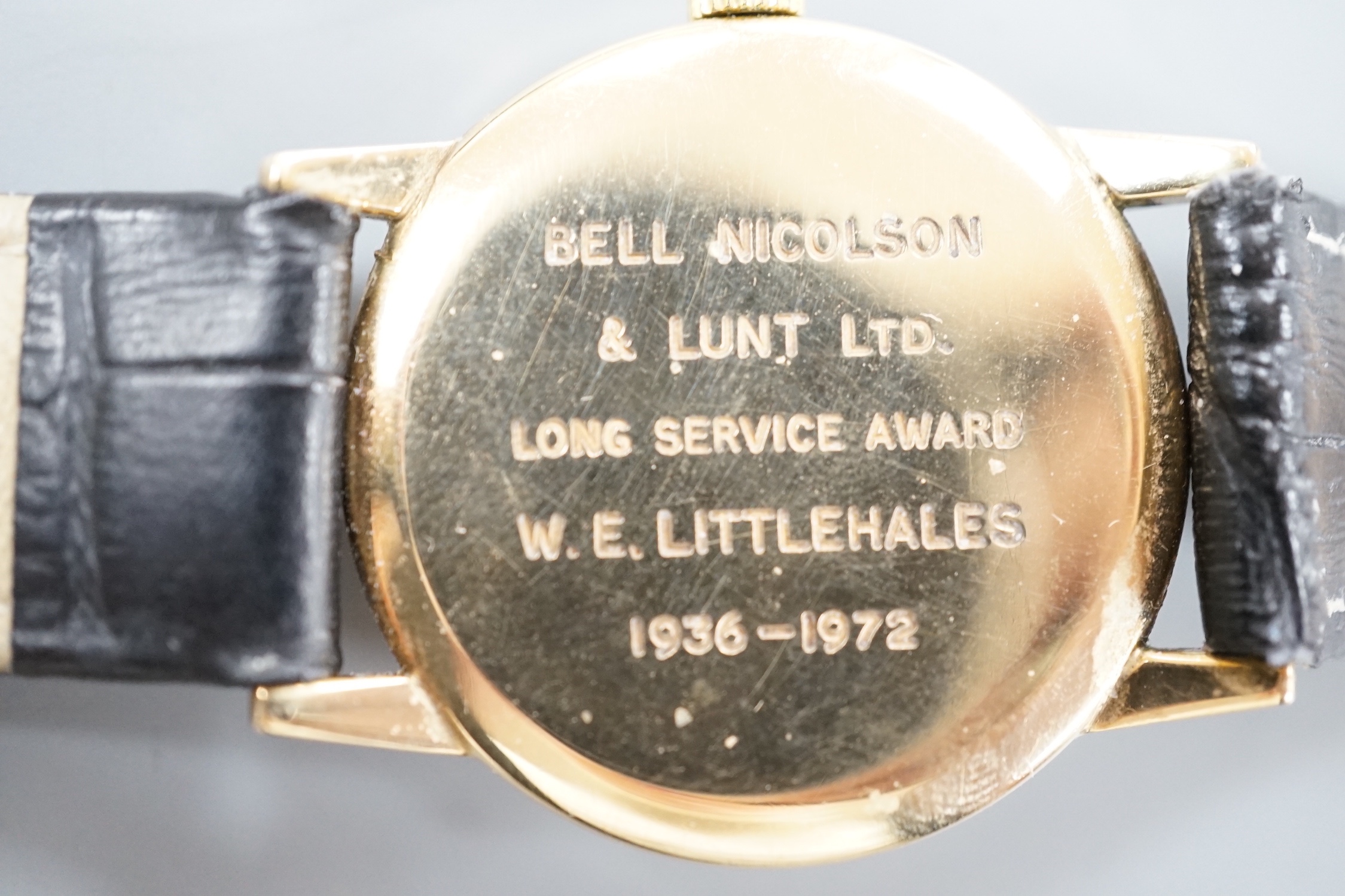 A gentleman's 1970's 9ct gold Tudor manual wind shock-resisting wrist watch, on a black leather strap, case diameter 33mm, with case back inscription